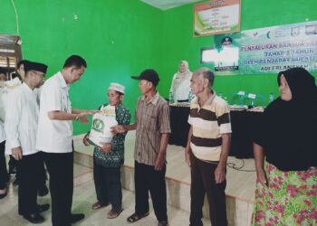 Pj.Bupati Pringsewu Serahkan Bantuan Pangan Beras